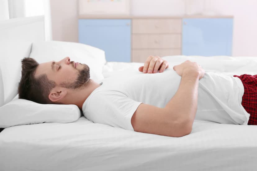 Man lying on his back on a mattress