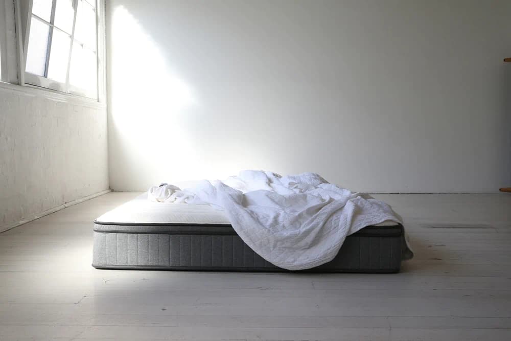 Mattress on the floor in an empty room