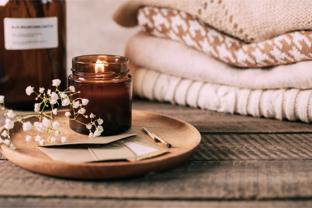 Burning candle in bedroom