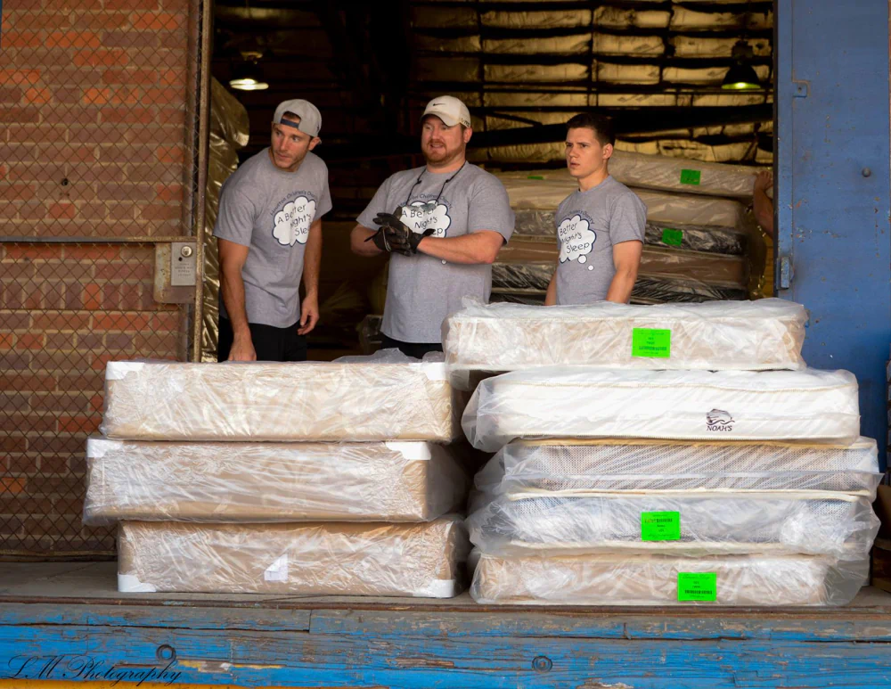 Texas Mattress Makers workers distributing mattresses