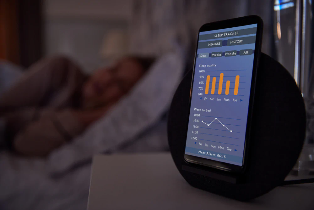 Smart mattress sleep app monitoring a woman sleeping